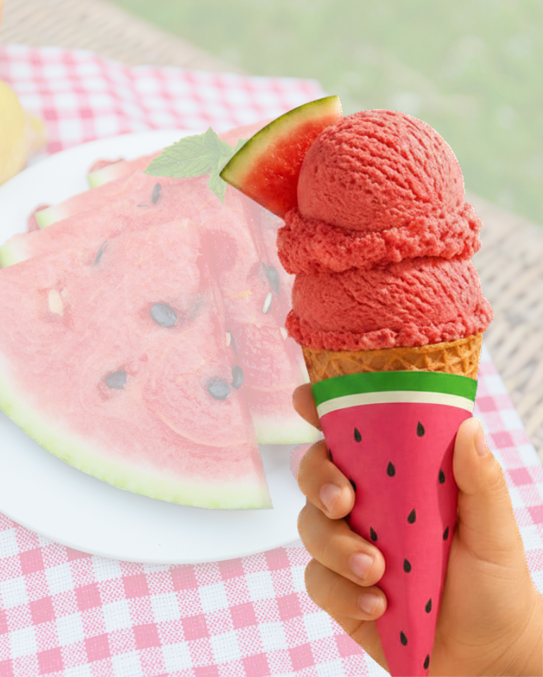 Child’s hand holding a watermelon ice cream cone wrapped in a printable watermelon cone sleeve with fresh watermelon slices and a bright summer background.